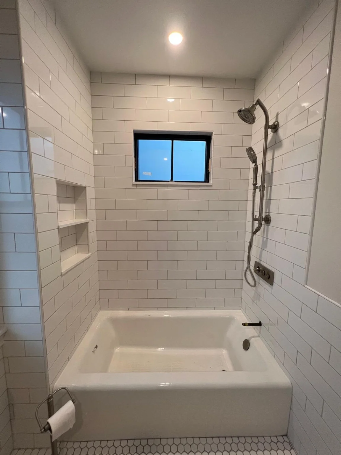 White subway tile and bathtub